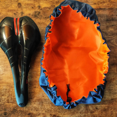 Seat cover for Bicycle saddle cover double-sided. A gift for a bicyclist traveler. Bag for biking and bikepacking. Bike saddle protection. Seat cover for Bicycle saddle cover double-sided. A gift for a bicyclist traveler. Bag for biking and bikepacking. Bike saddle protection.